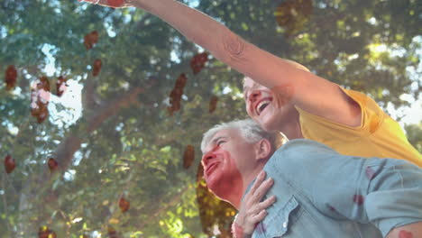 pareja de pie en el parque con corazones