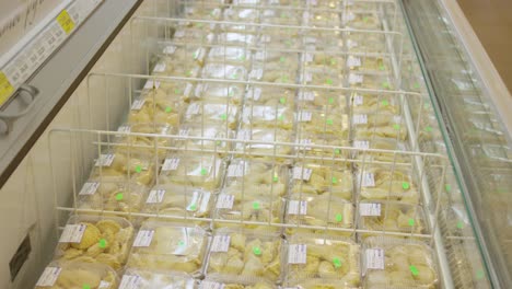 frozen pierogi display in grocery store freezer