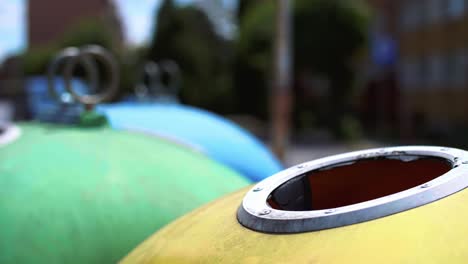 Man-throwing-plastic,-empty-bottle-into-recycling-bin