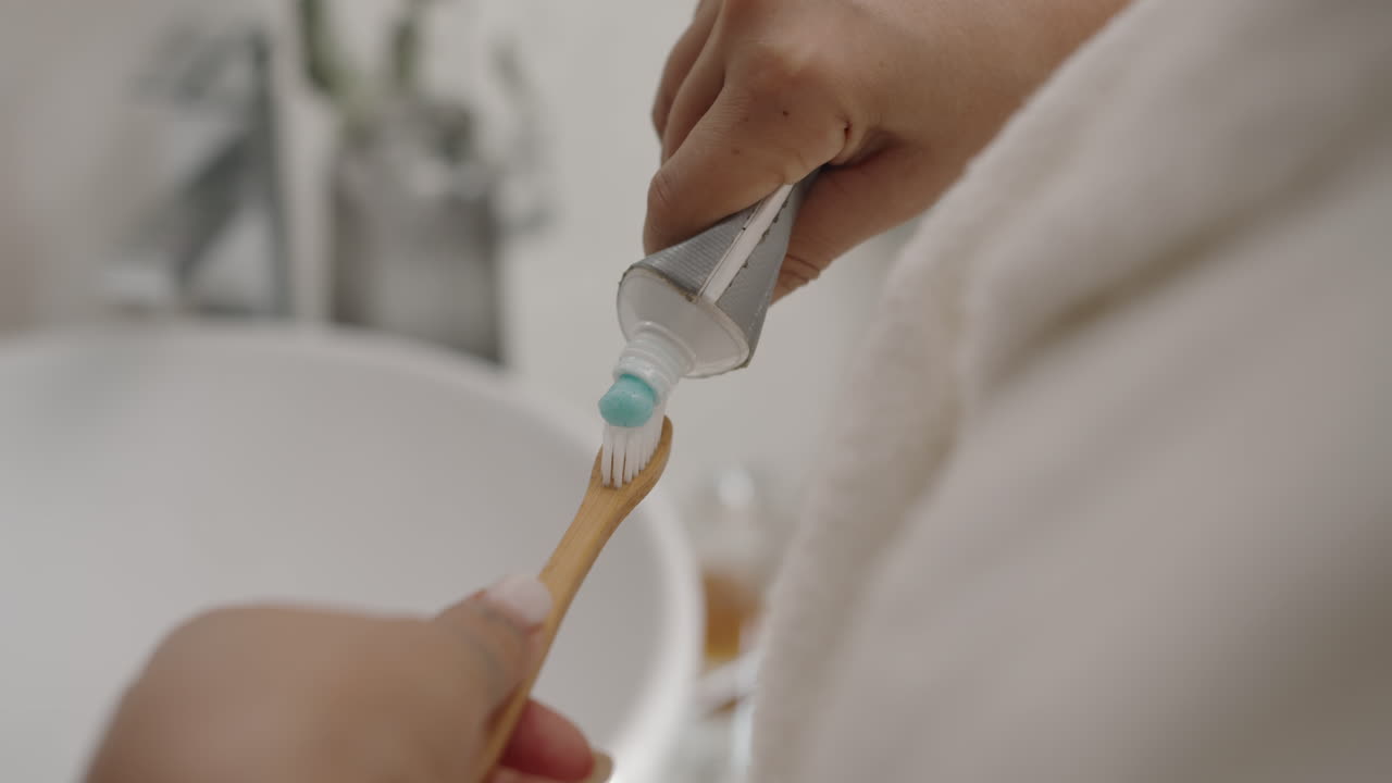 Unrecognizable Girl Applying Whitening Toothpaste on Toothbrush