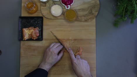 cutting chicken before cooking in the kitchen