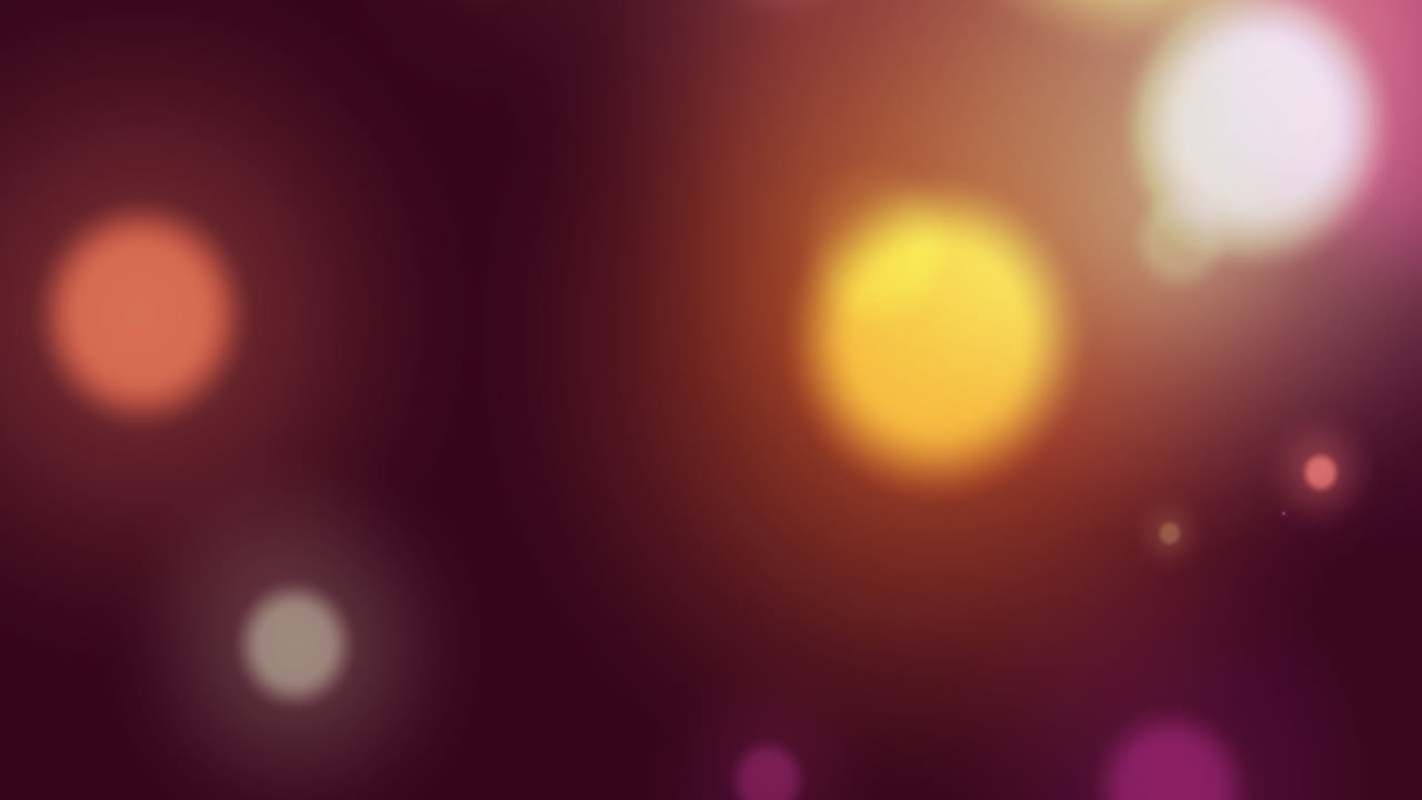 Animation of multi coloured glowing spots of light moving in hypnotic motion on background