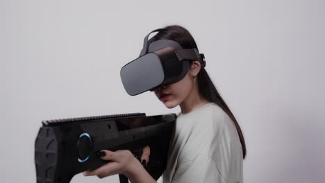 woman playing vr shooting game