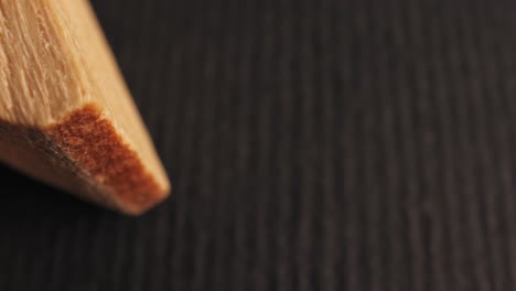 clothes pin on black surface, macro shot