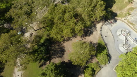 Aerial-tilt-shot-over-the-central-park,-revealing-the-cityscape-of-Lincoln-square,-NY