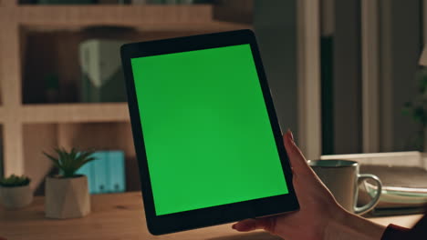 customer zooming green screen tablet at evening home closeup. unknown woman