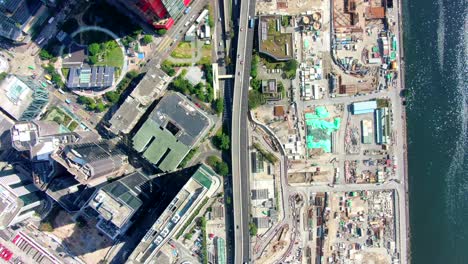 hong kong downtown kowloon urban area, top down aerial view with traffic and city skyscrapers