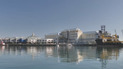 buildings and boats at cape town waterfront viewed from the water