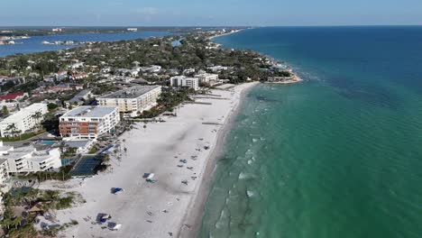 white sugar sand beaches and coastal properties along the full southern coastline of famous siesta key island beach near south sarasota, florida