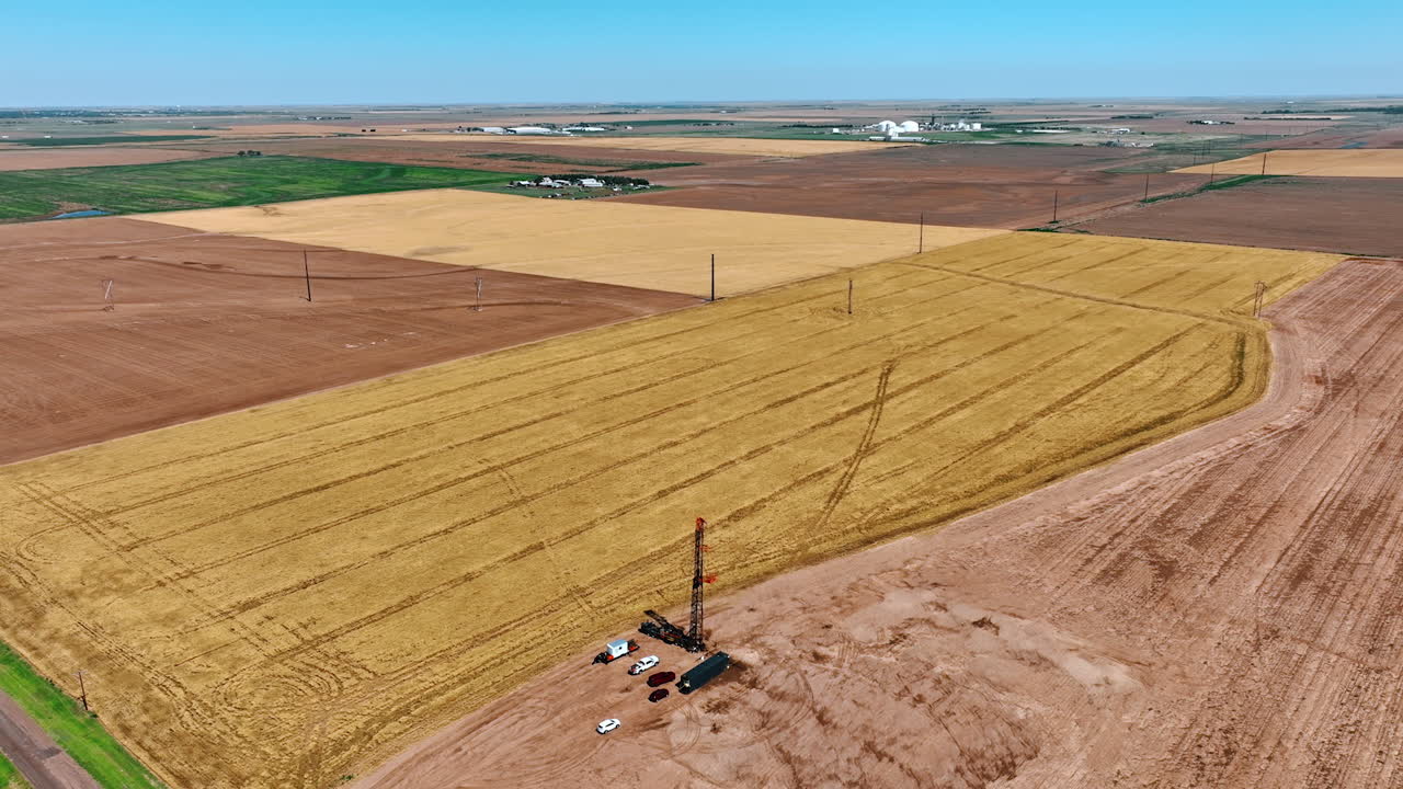 Distancing from the little location with oil production in the vast field. Rising up over the area for drilling natural resources.