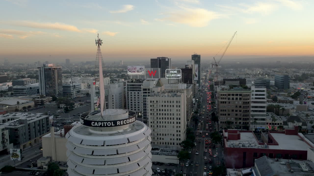 Aerial view of Capitol Records Building and Hollywood cityscape at dusk