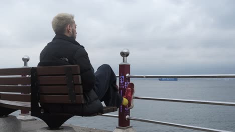 sitting bench across sea