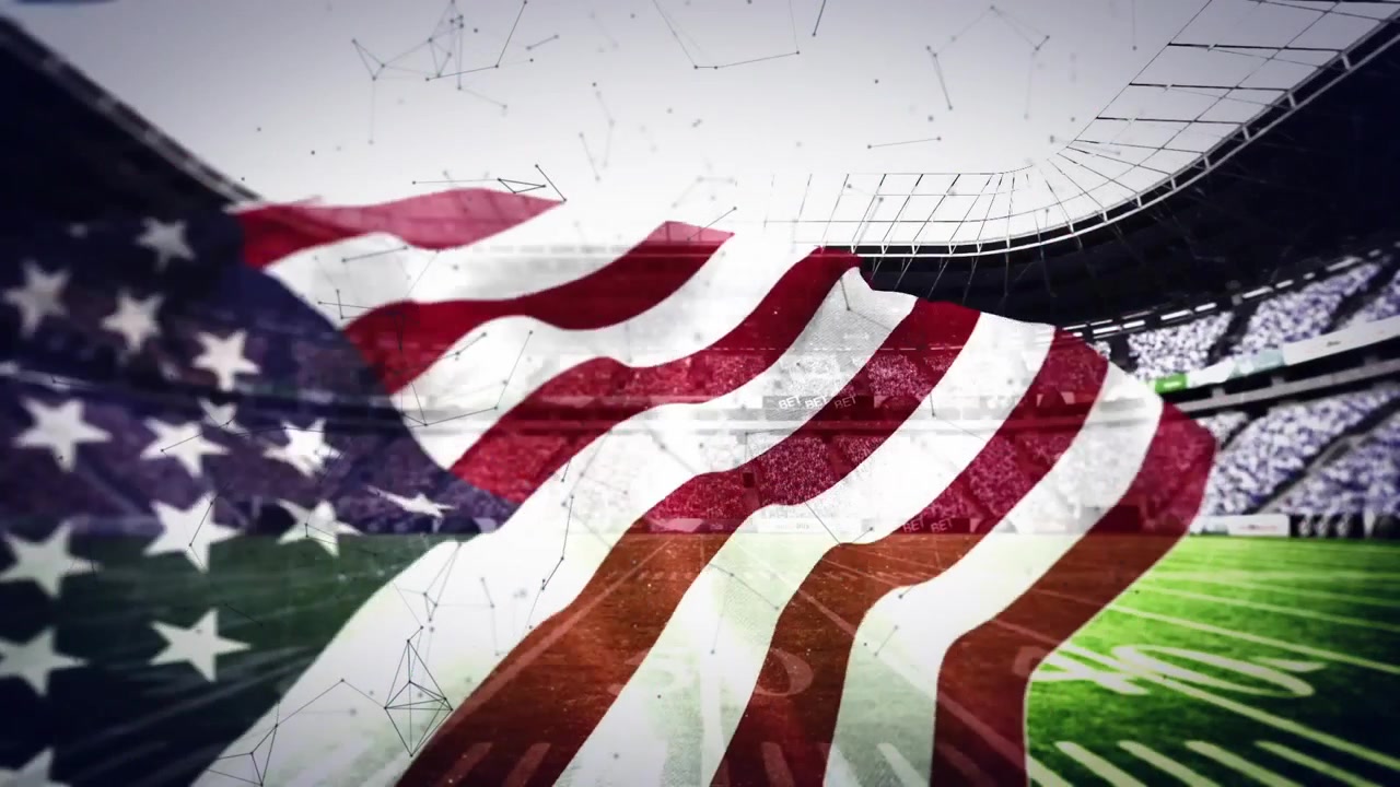Waving American Flag with a Sports Stadium Background