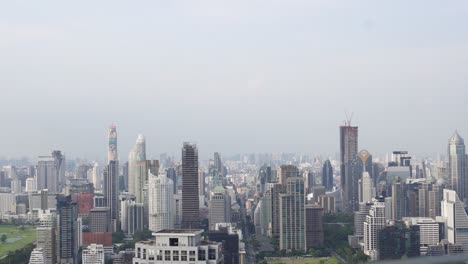 A-beautiful-skyline-view-of-the-many-impressive-skyscrapers-of-Bangkok,-the-capital-of-Thailand-on-a-clear-blue-day