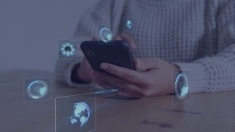 Person using smartphone with digital icons and globe animation overlay