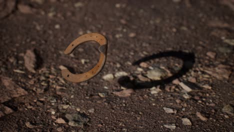 extreme slow motion old rusty metal horseshoe