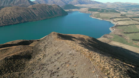 Hiking-Down-Magnificent-New-Zealand-Mountain-Ridge-In-Canterbury-South-Island-Drone-Rise-Above