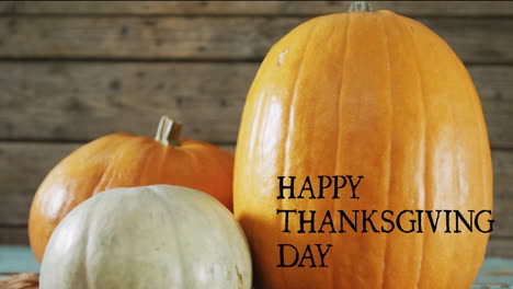 animation of happy thanksgiving day text over autumn pumpkins