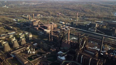 ostrava's non-operational steel blast furnaces at liberty steel, surrounded by urban greenery. ostrava, czech republic