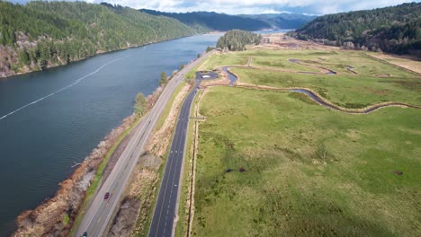 4k aerial drone shot gliding over road in reedsport, oregon