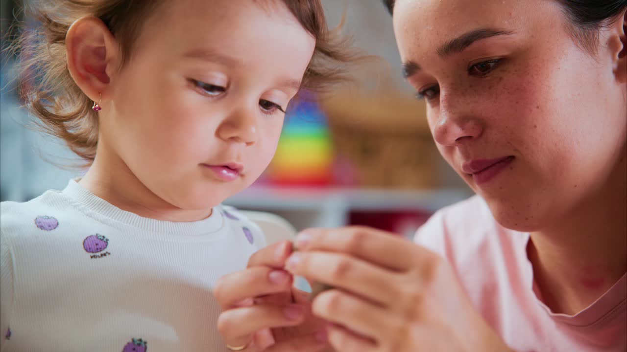 Caring Moments: A Joyful Interaction Between a Mother and Her Young Daughter Exploring Creativity and Learning Through Playful Activities in a Bright Environment
