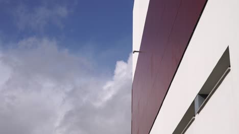 timelapse of the clouds with building on the side.sunny day, clear