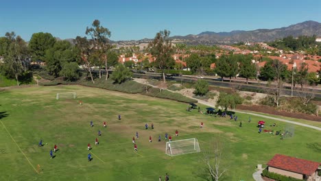 aerial view of a soccer game between red and blue at melinda park in mission viejo, california