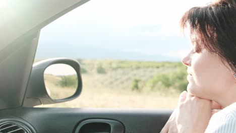 Enjoying-the-wind-in-her-hair-on-a-refreshing-drive-in-the-countryside