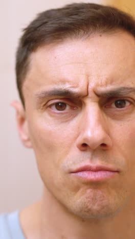 man drying and styling hair in bathroom