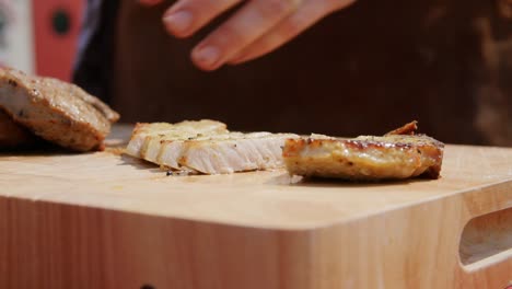 Sliced-pieces-of-meat-on-a-wooden-table