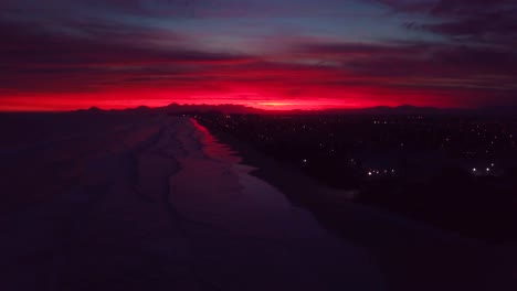 late evening ascending aerial shot of sunset and beach of itanhaem on the ocean