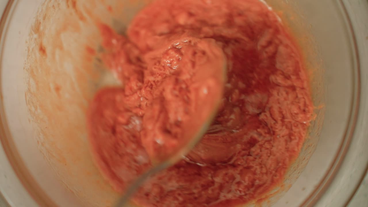 Mixing up asian peanut sauce with spoon