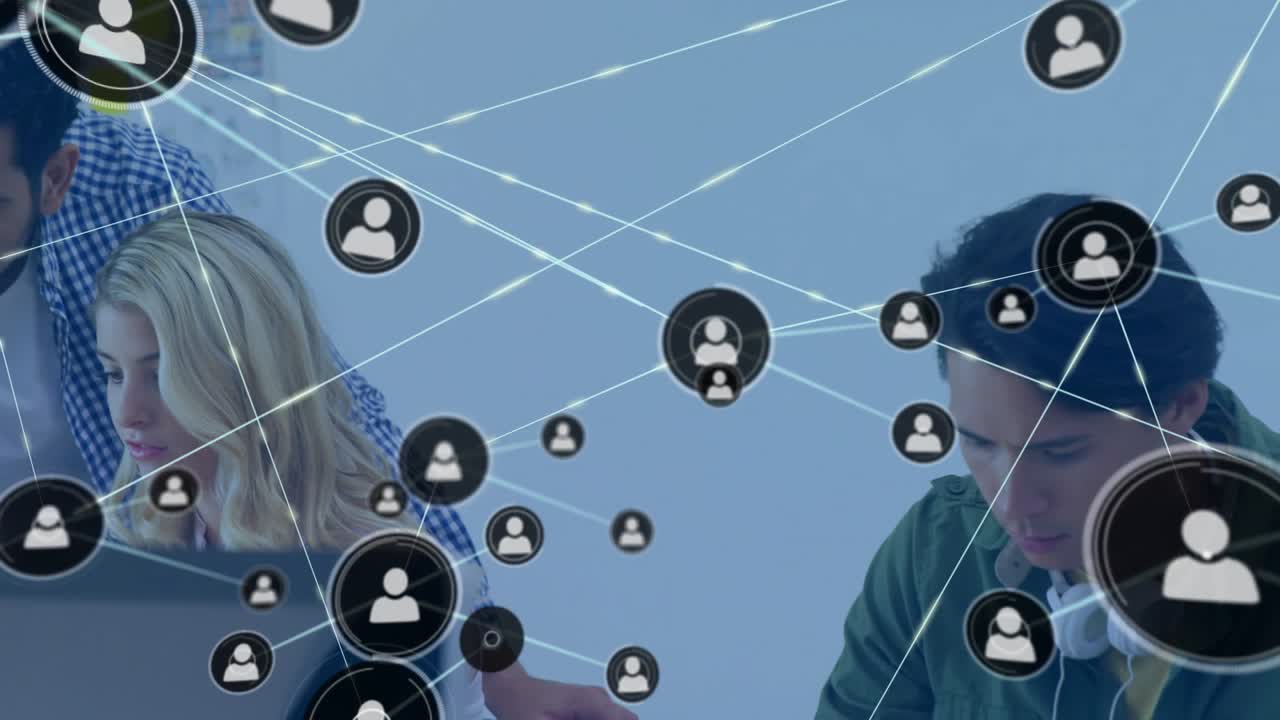 Man with headset using laptop, user icon appearing by him, network expanding showing tech teamwork