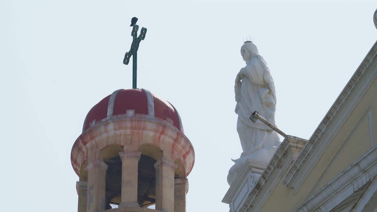 Static shot of the Saint Mary statue atop Santa Maria Cathedral at Chiclayo, Lambayeque, Peru during daytime