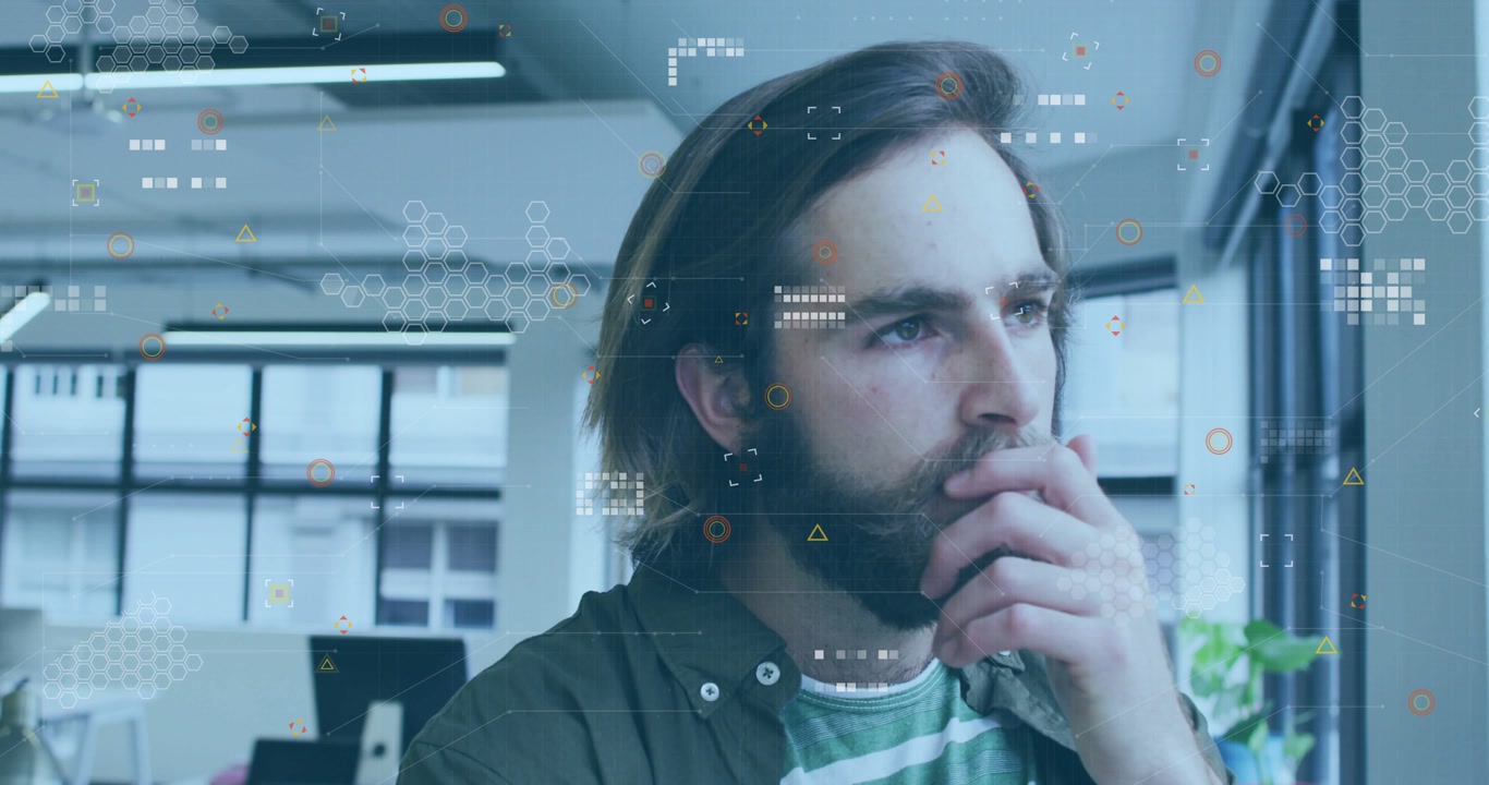 Adult man standing by window, overlays appearing as HUD while he touches chin studying technology