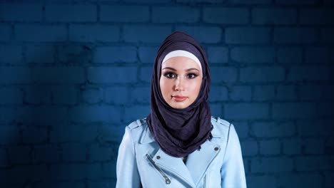 woman wearing hijab and a light blue jacket