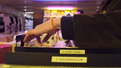 man browsing record collection