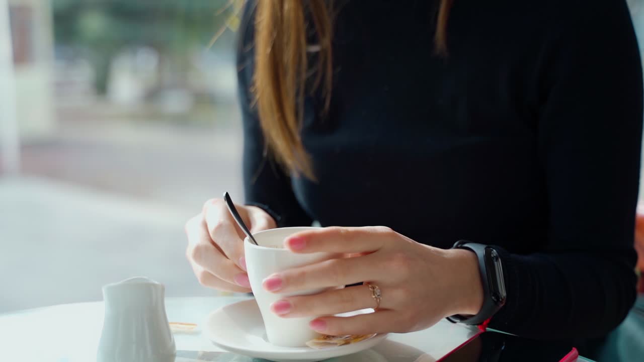 Woman in coffee shop. Woman in the cafe sits at table