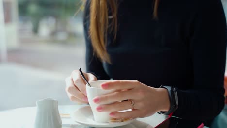 woman in coffee shop. woman in the cafe sits at table