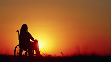 disabled woman contemplating sunset