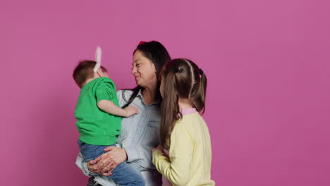 Adorable-lovely-family-showing-love-and-laughing-on-camera