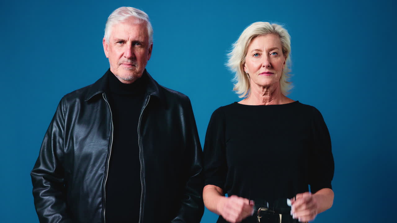 Stylish Older Couple Posing in Studio