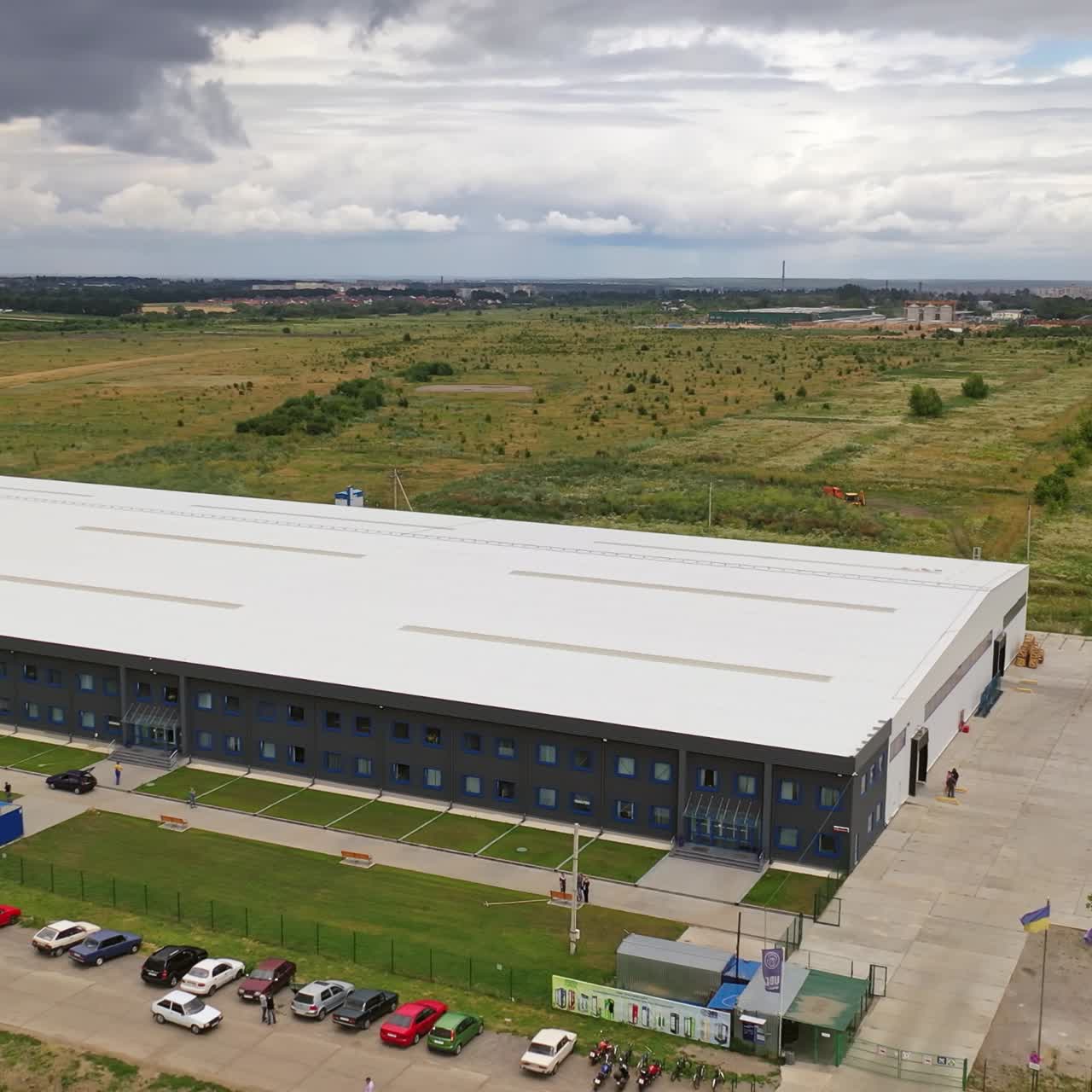 Aerial view of a modern industrial building and warehouse