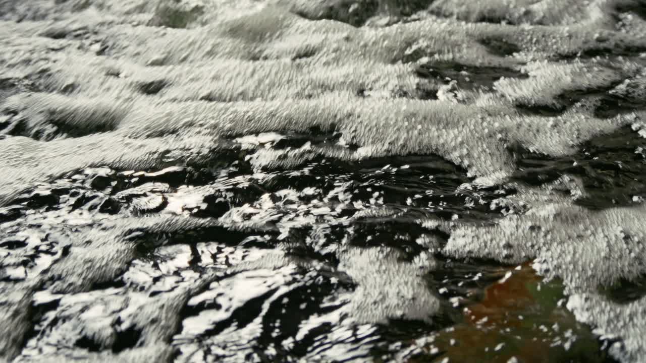 Discover the serene beauty of bubbling water a natural stream showcasing nature's calming effects