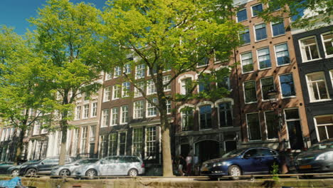 parked cars by amsterdam canal