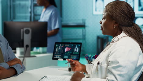 african american doctor and patient having in depth conversation about results