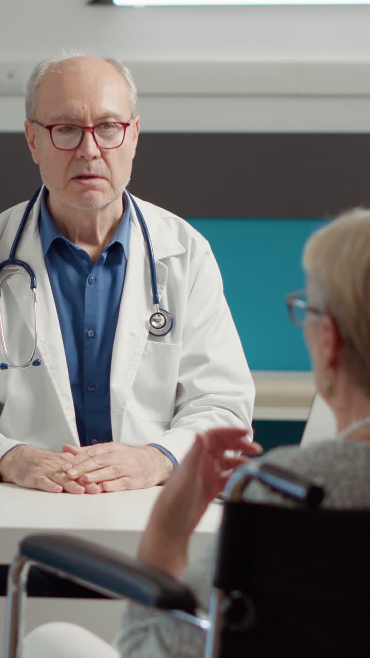 Doctor consulting with elderly patient