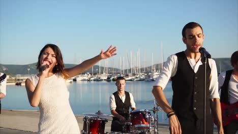 band performing at a harbor