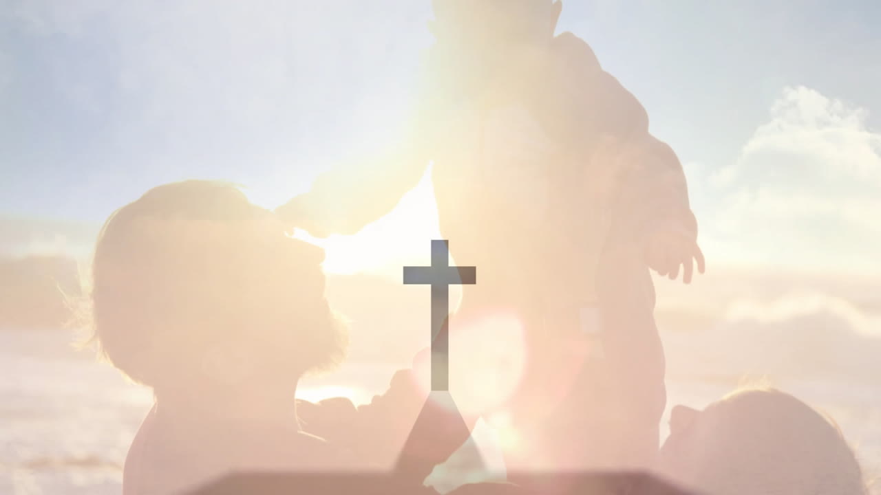 Animation of silhouetted family with child and cross symbol against bright sky