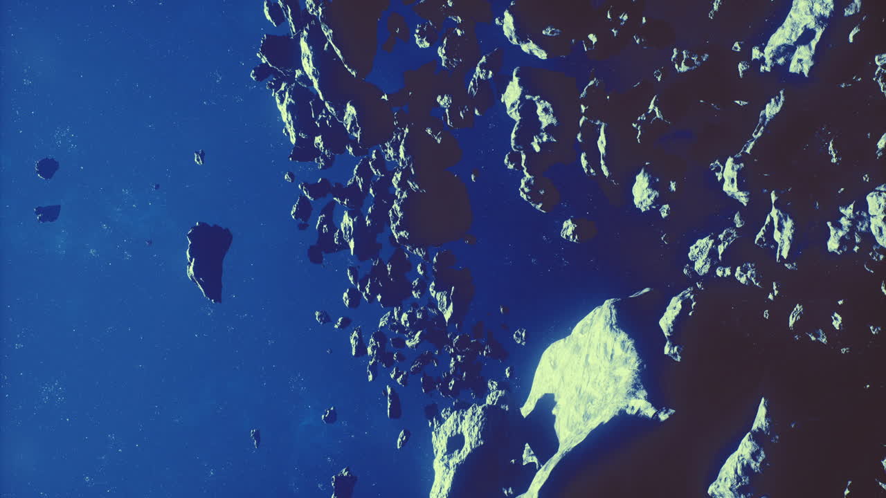 View of asteroids in deep space against a dark background